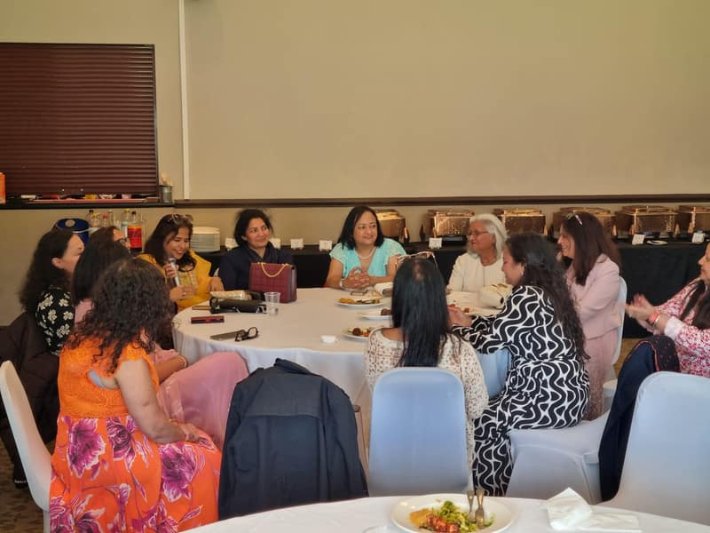 Guests talking around a round table